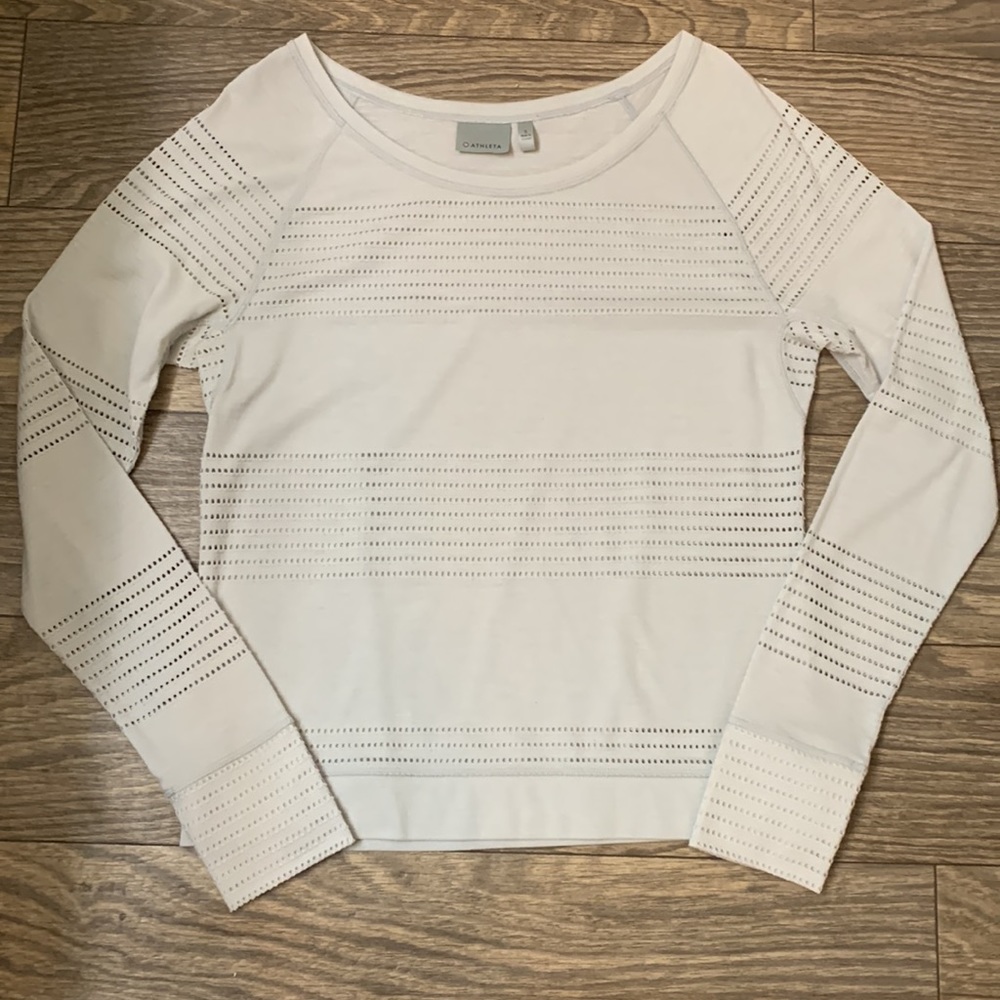 Long sleeve Athleta shirt with cut-out details, laser cut like throughout